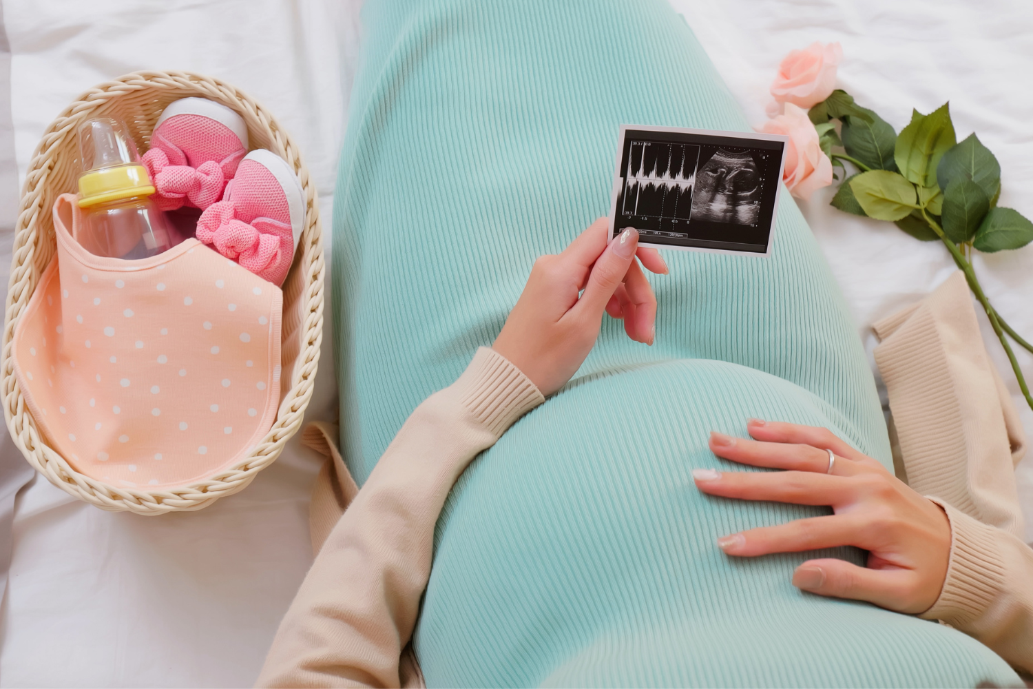 Mom opening a meaningful-baby shower-gift-and-smiling-with joy.