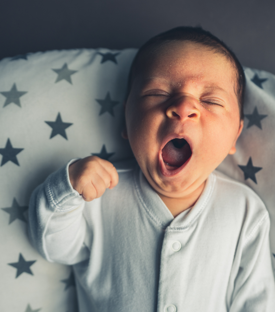 newborn-sleep-cues-yawning-eye-rubbing-sleepy-baby-signs